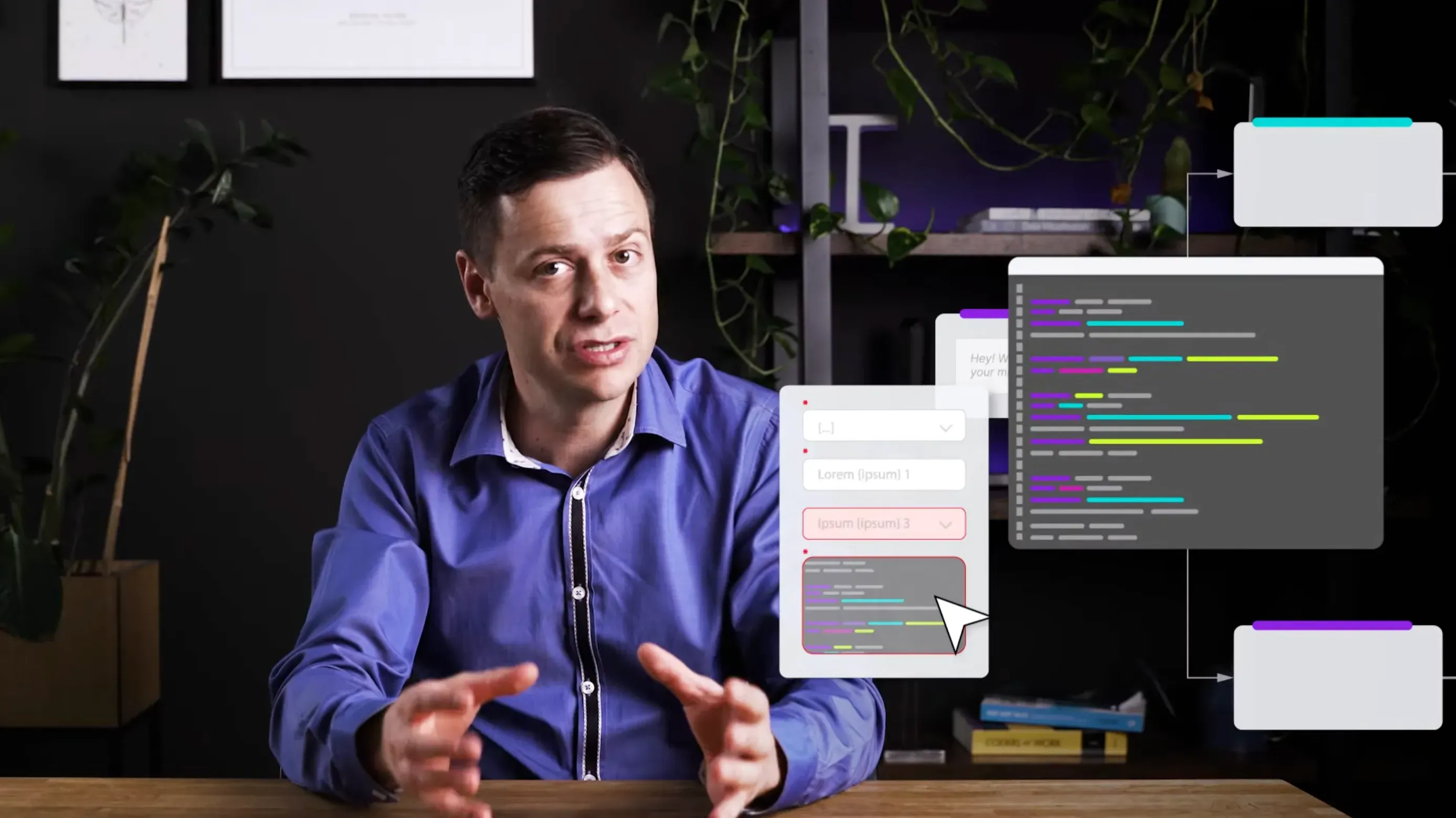 Video frame with the presenter talking at a desk while animated UI graphics float beside him: form fields with a cursor, a code panel and connected diagram boxes